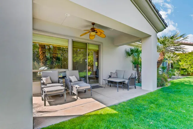 a living room with furniture and garden view