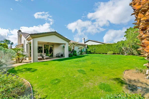 a view of a house with a garden