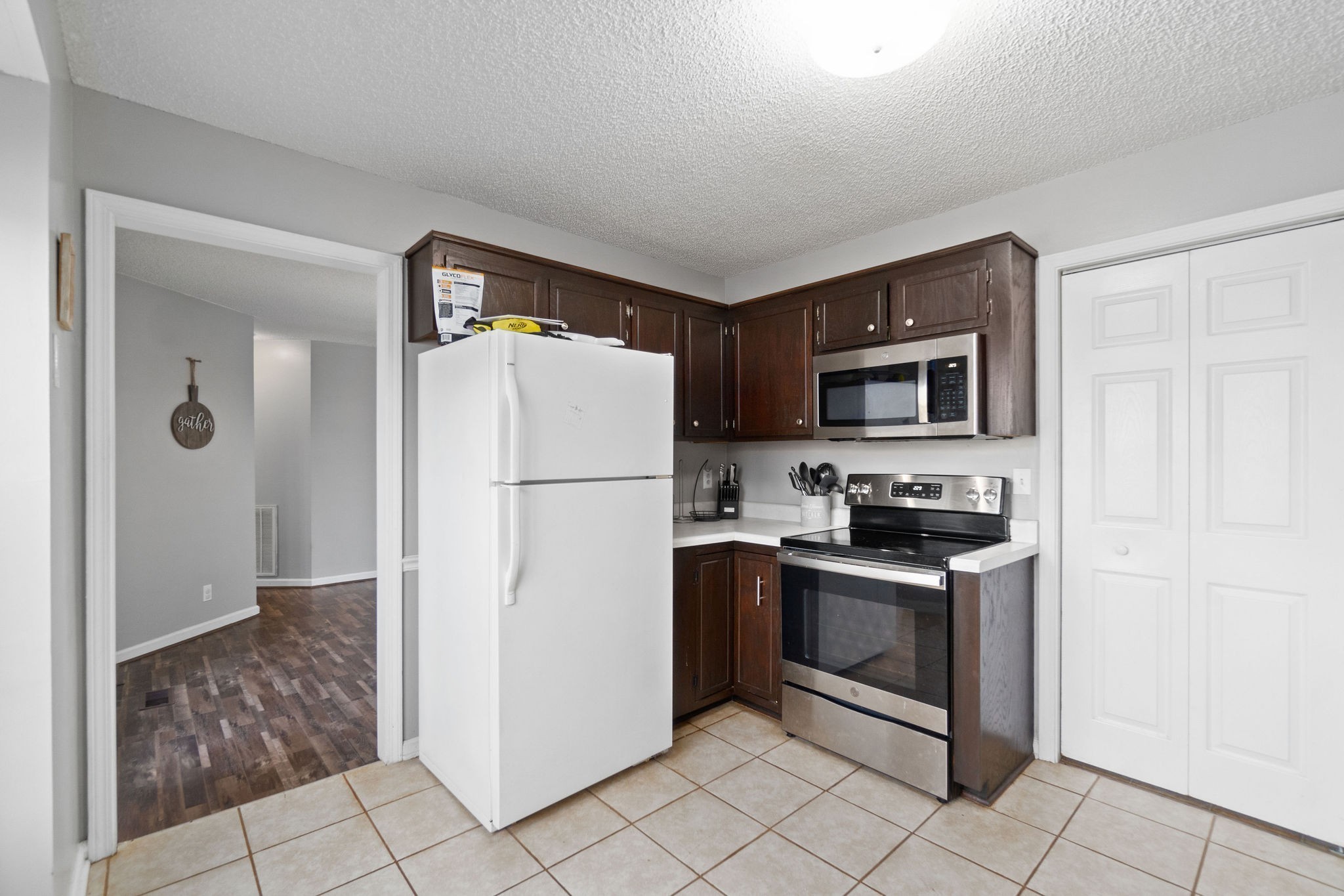 417 McMurry Road Clarksville, TN 37042 - Photo 2 of 9 a kitchen with stainless steel appliances granite countertop a refrigerator stove and sink