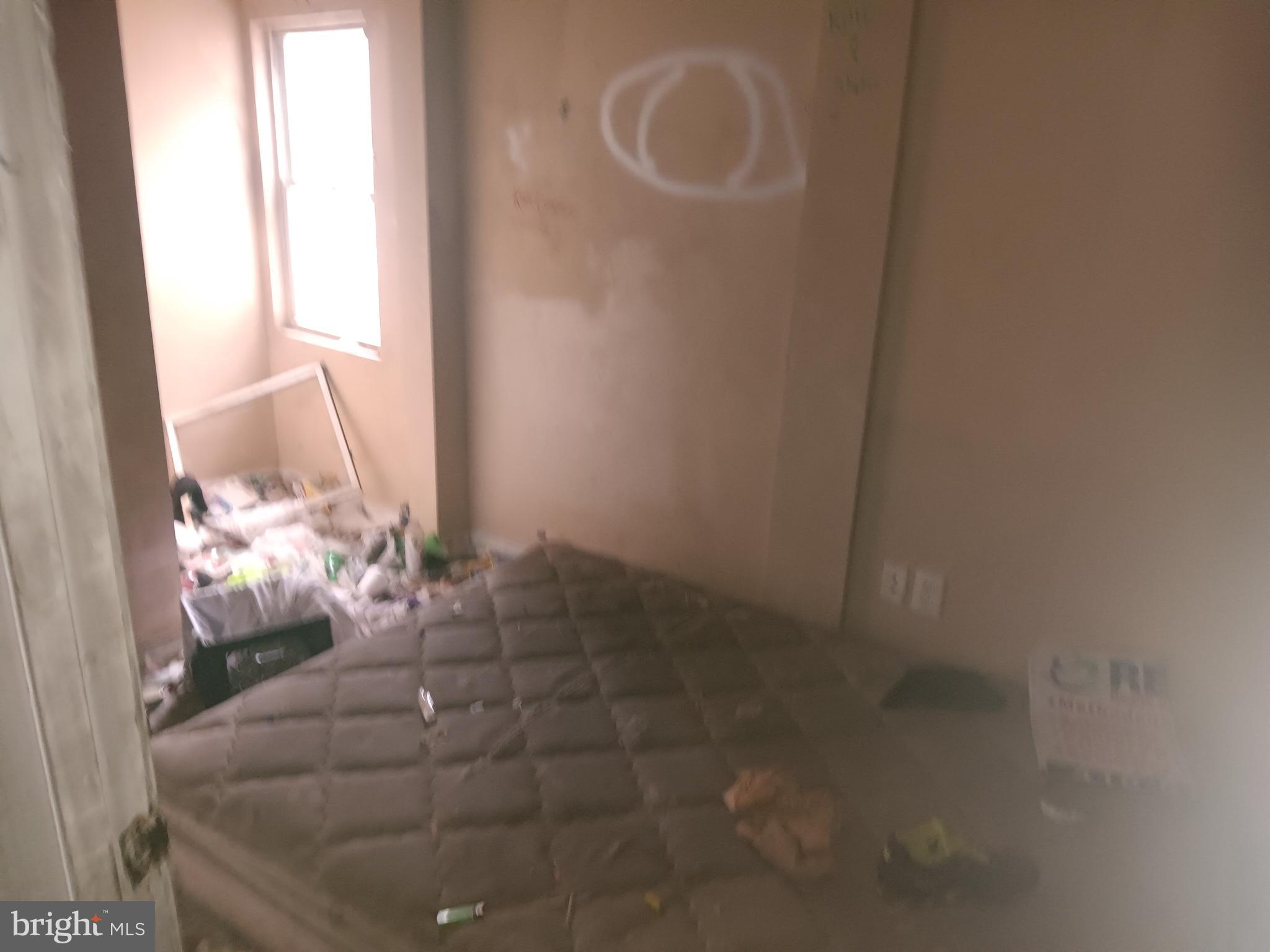 2227 Christian Street Baltimore, MD 21223 - Photo 11 of 12 a room with a window