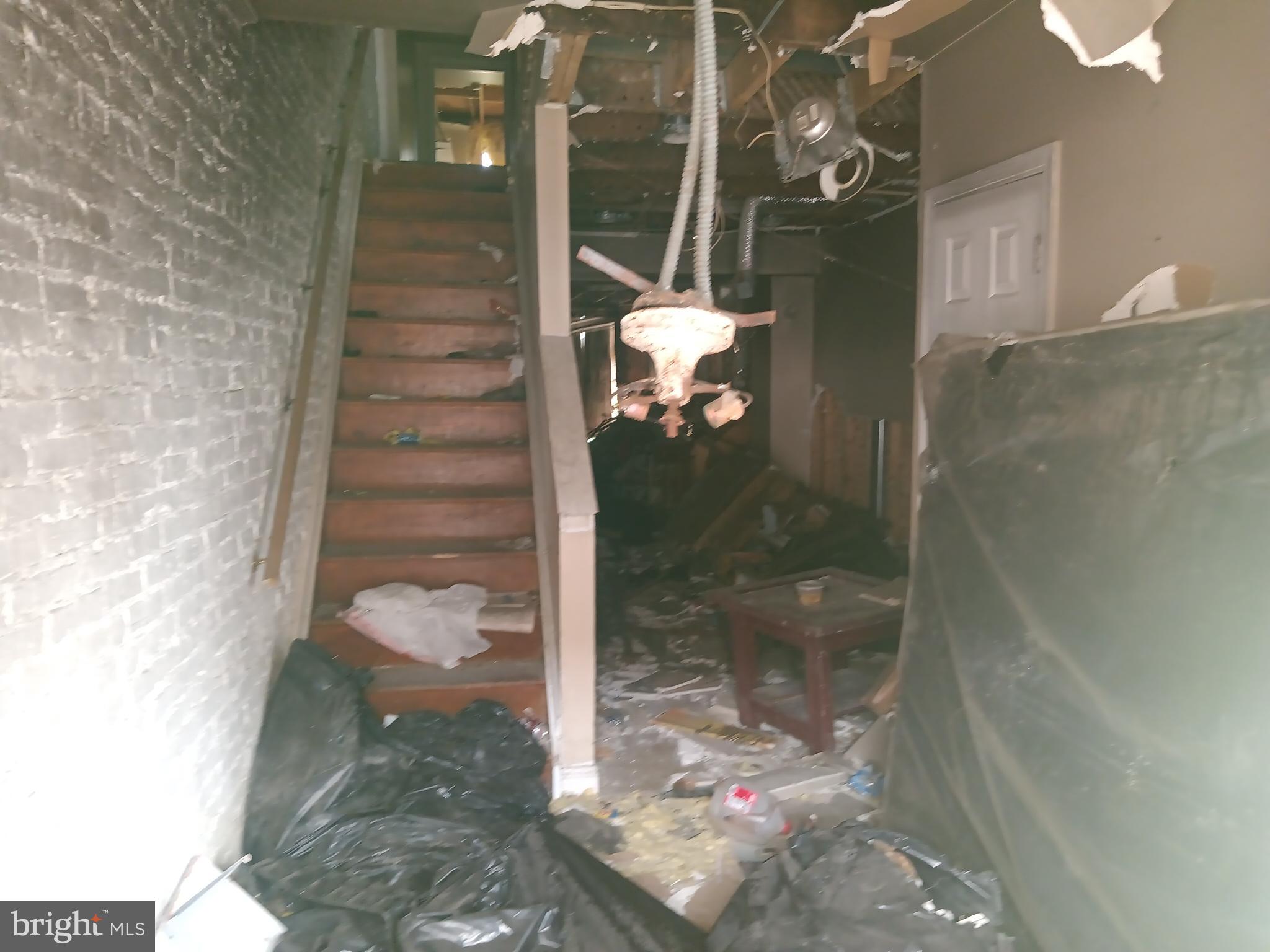 2227 Christian Street Baltimore, MD 21223 - Photo 2 of 12 a bathroom with a glass shower door