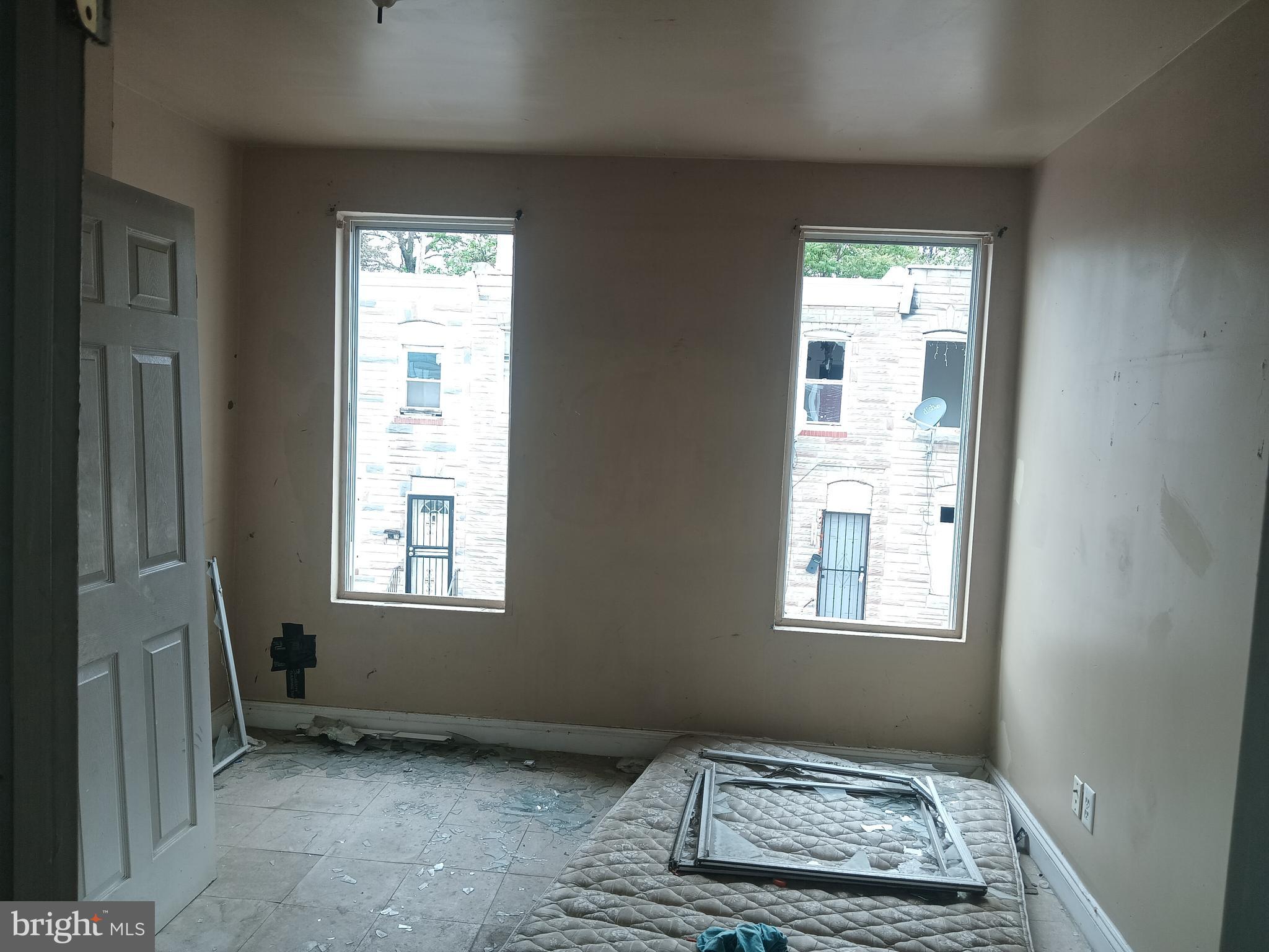 2227 Christian Street Baltimore, MD 21223 - Photo 9 of 12 an empty room with windows