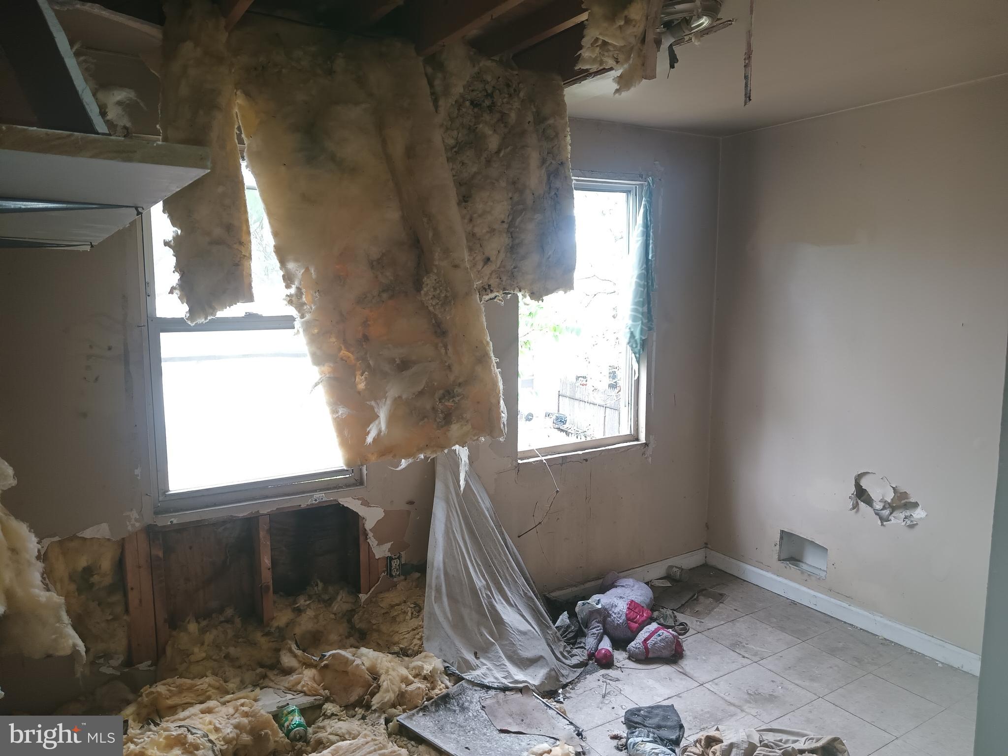 2227 Christian Street Baltimore, MD 21223 - Photo 10 of 12 a living room with furniture and a window