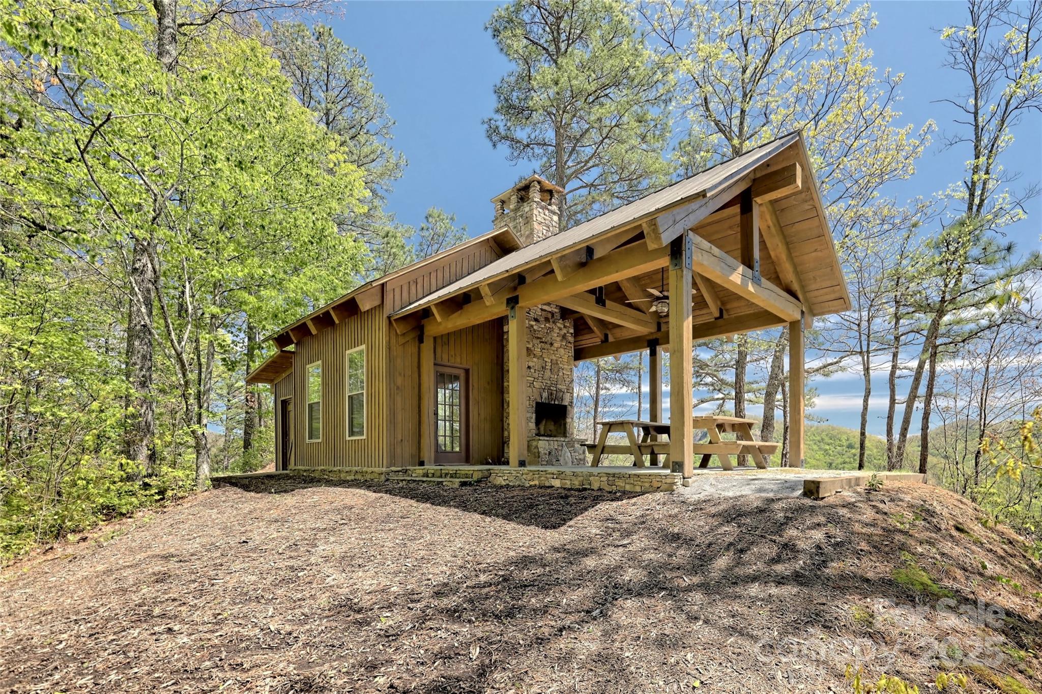Lot 13 Hares Ear Lane, Unit 13 Cullowhee, NC 28723 - Photo 16 of 23 a front view of a house with a yard