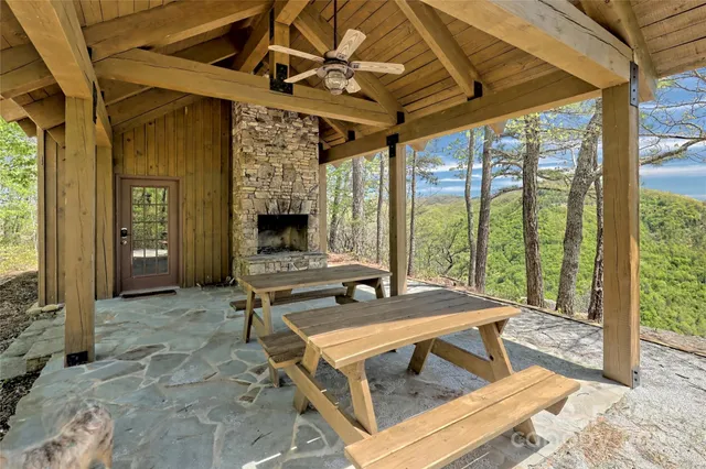 a living room with fireplace furniture and a flat screen tv
