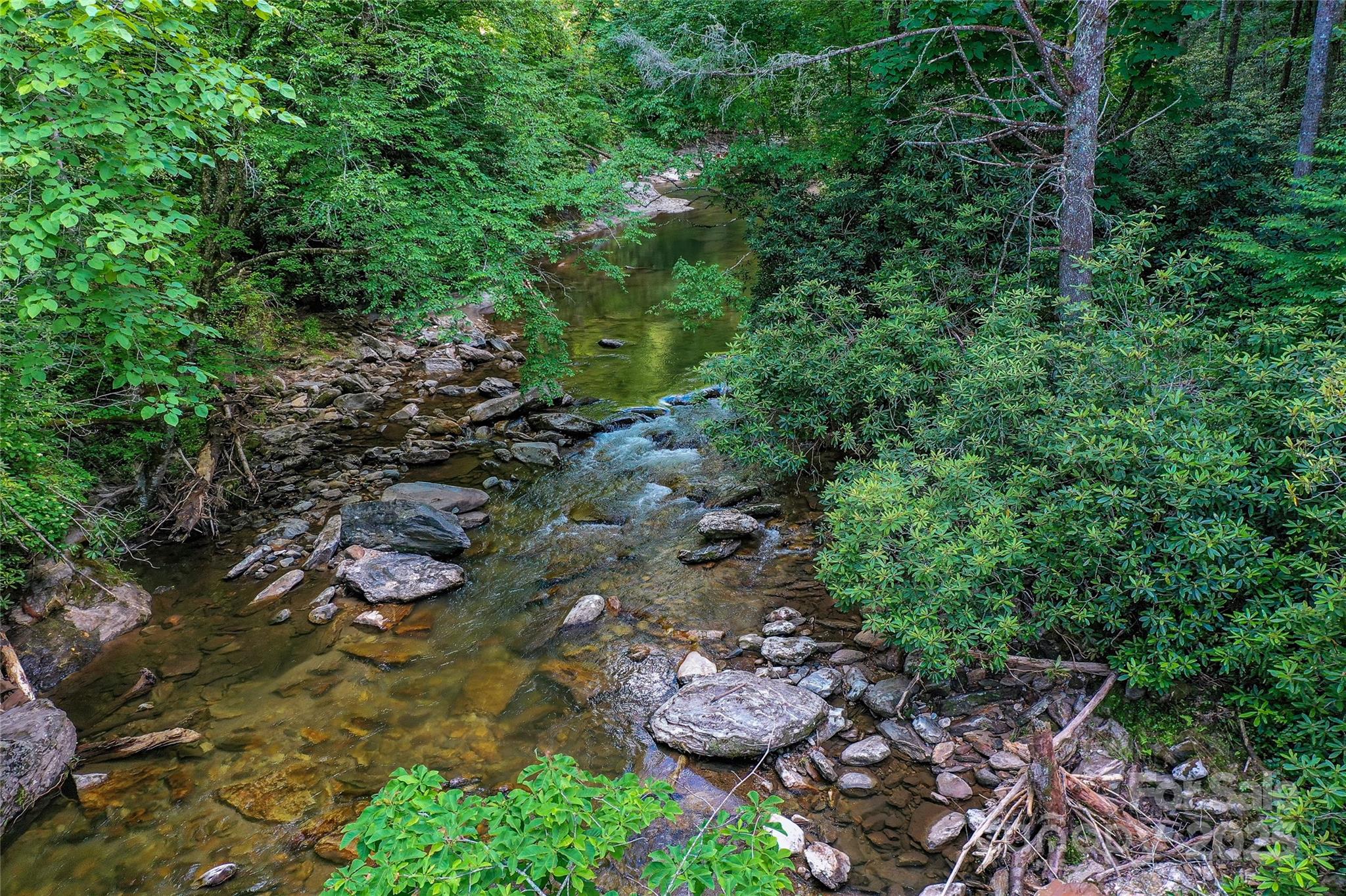 Lot 13 Hares Ear Lane, Unit 13 Cullowhee, NC 28723 - Photo 5 of 23 a view of lake with green space