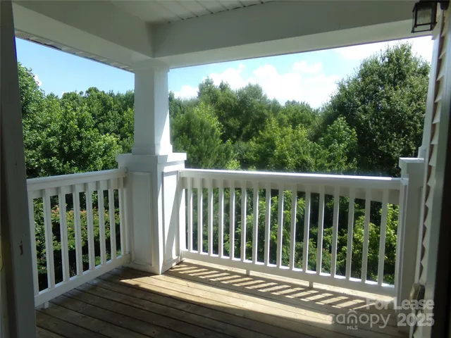 a view of a yard from a balcony