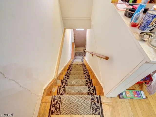 a kitchen with granite countertop a refrigerator stove top oven and sink