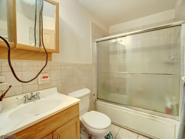 a bedroom with a bed and flat screen tv