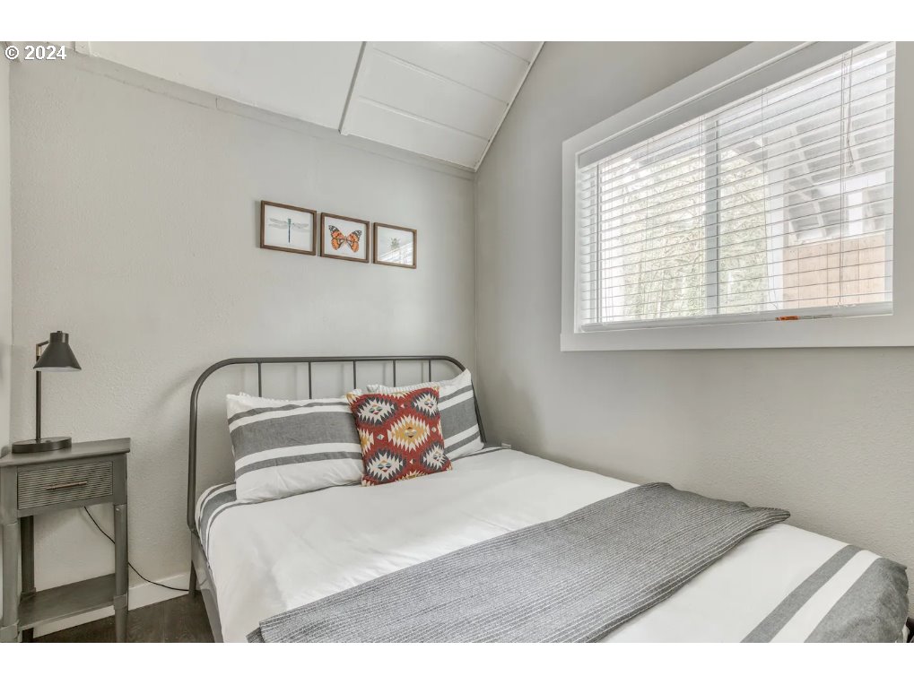 23795 East Lolo Pass Road Rhododendron, OR 97049 - Photo 13 of 19 a bedroom with a bed and window