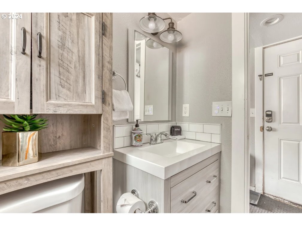 23795 East Lolo Pass Road Rhododendron, OR 97049 - Photo 17 of 19 a bathroom with a sink and a mirror