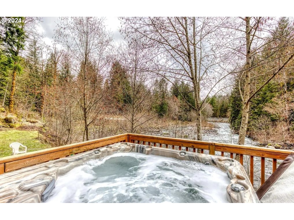23795 East Lolo Pass Road Rhododendron, OR 97049 - Photo 2 of 19 a view of a swimming pool with a yard