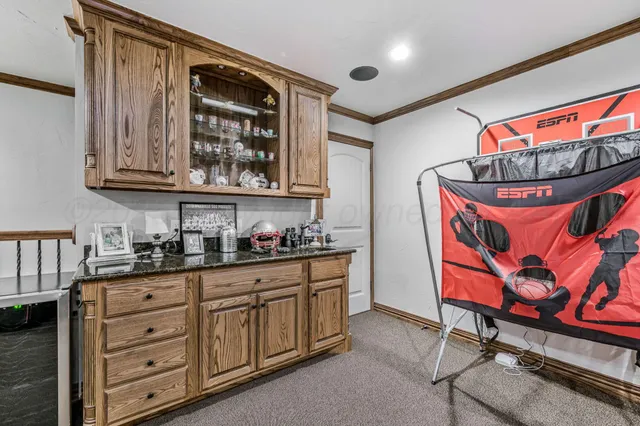 a kitchen with stainless steel appliances granite countertop a stove and cabinets