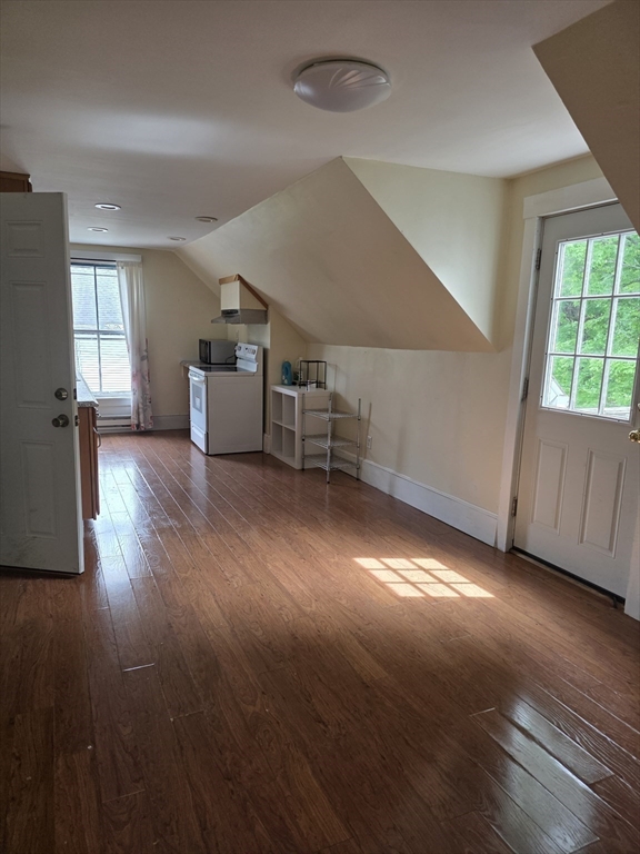 48 Maple Street, Unit 2 Holden, MA 01520 - Photo 5 of 11 a view of a livingroom with wooden floor and windows