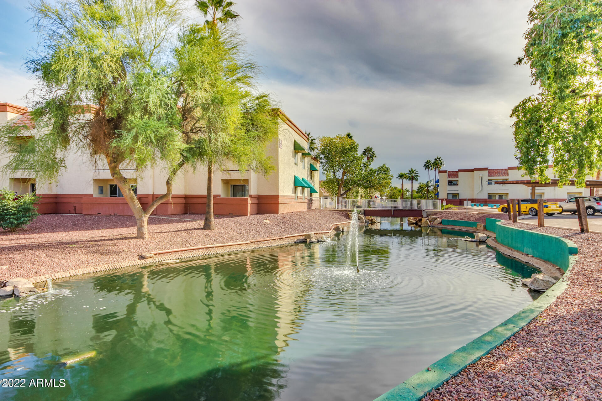 12123 West Bell Road, Unit 159 Surprise, AZ 85378 - Photo 16 of 21 a view of a lake with a house