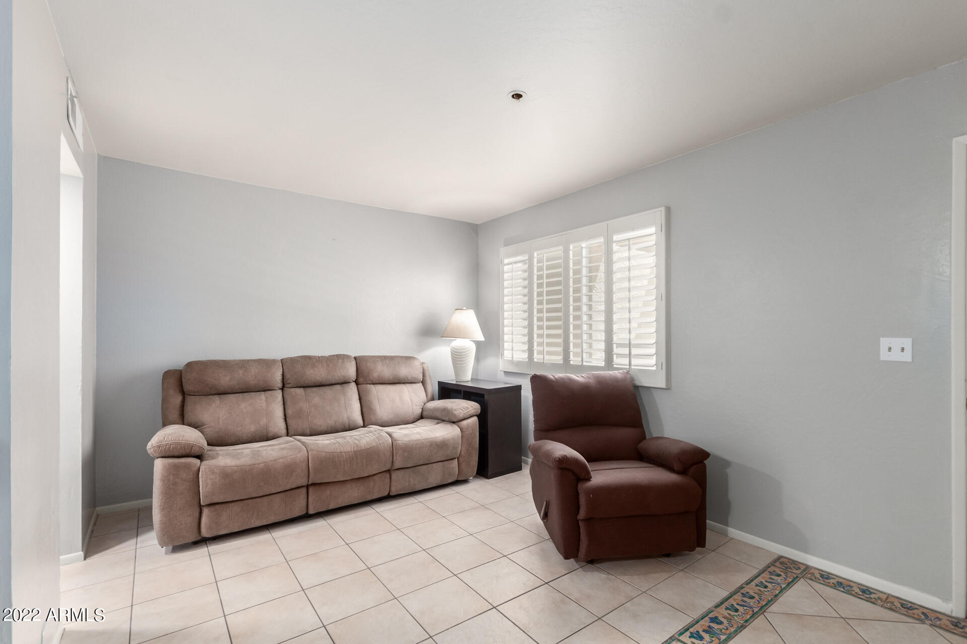 12123 West Bell Road, Unit 159 Surprise, AZ 85378 - Photo 6 of 21 a living room with furniture and a couch