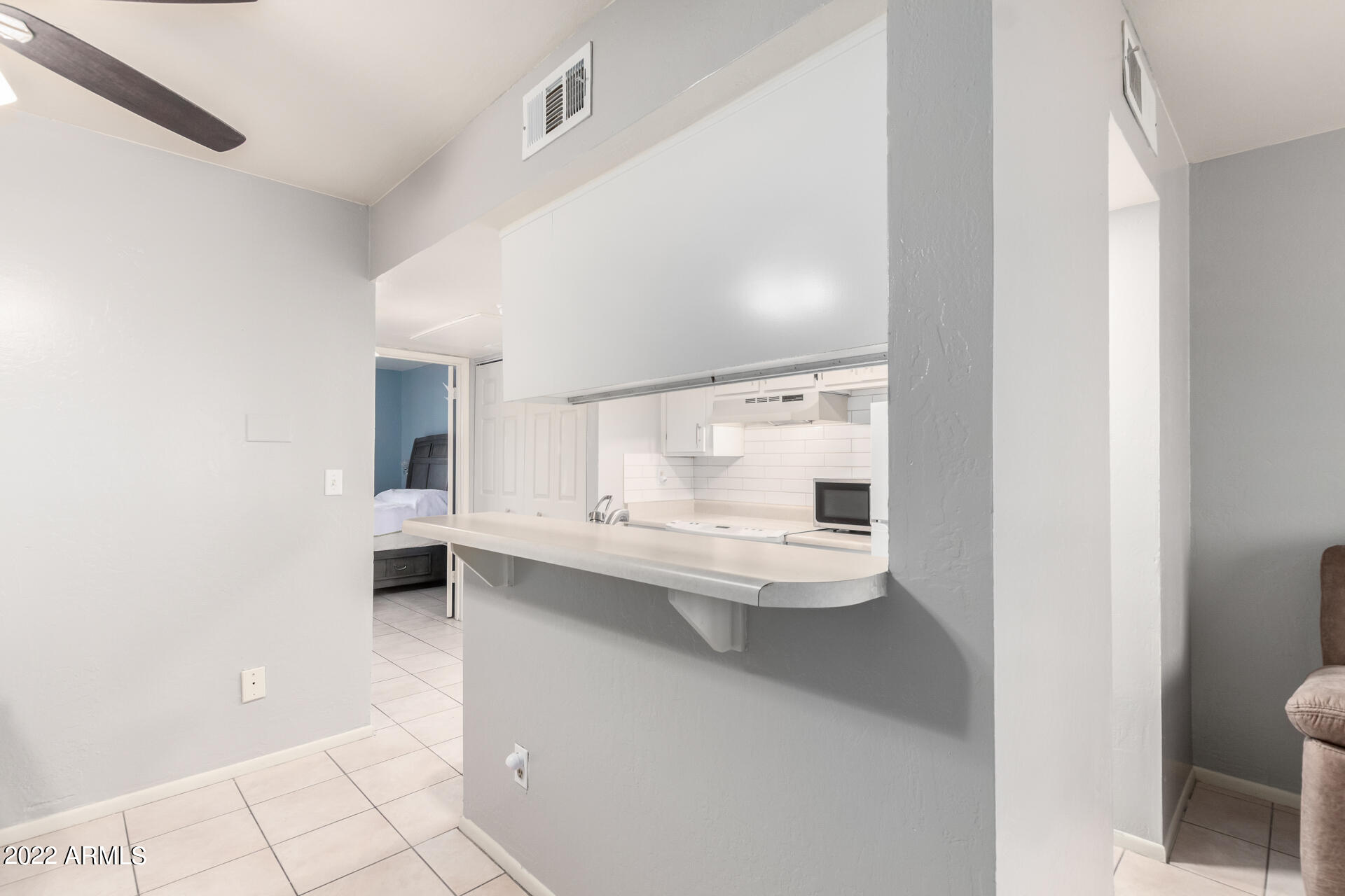 12123 West Bell Road, Unit 159 Surprise, AZ 85378 - Photo 8 of 21 a bathroom with a sink a toilet and a shower
