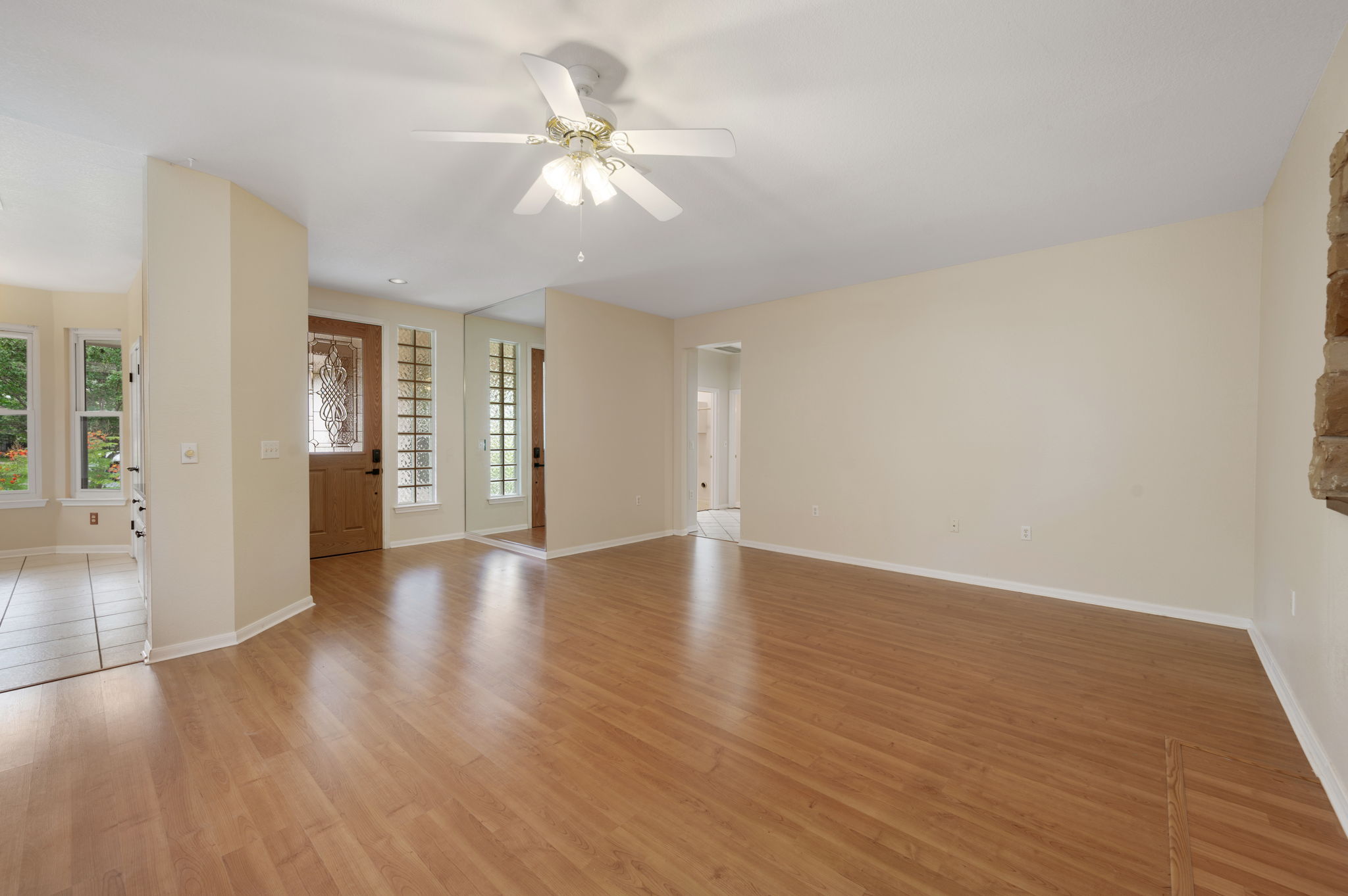 118 Bass Street Georgetown, TX 78633 - Photo 12 of 40 Hardwood flooring extends throughout this generous living space, leading to a charming entryway.