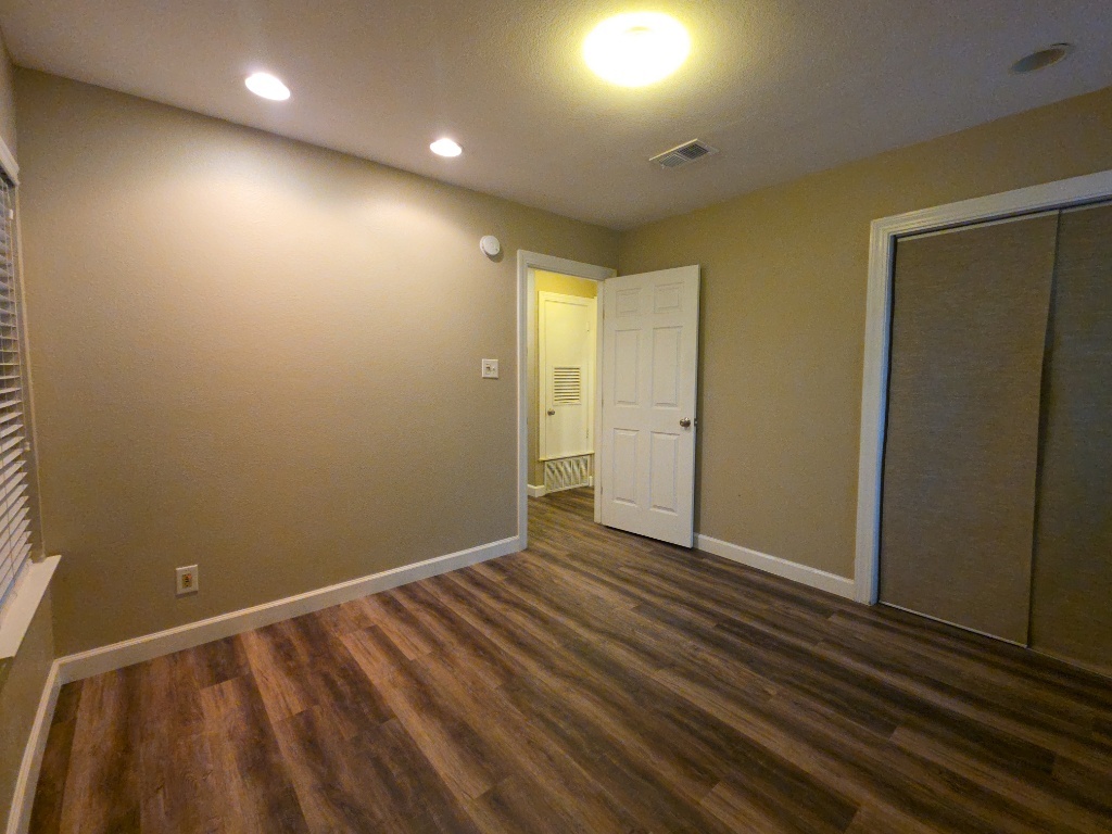 4707 Philco Drive Austin, TX 78745 - Photo 12 of 19 Bedroom with closet and recessed lighting