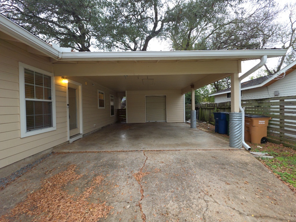 4707 Philco Drive Austin, TX 78745 - Photo 19 of 19 View of parking with an attached carport and concrete driveway