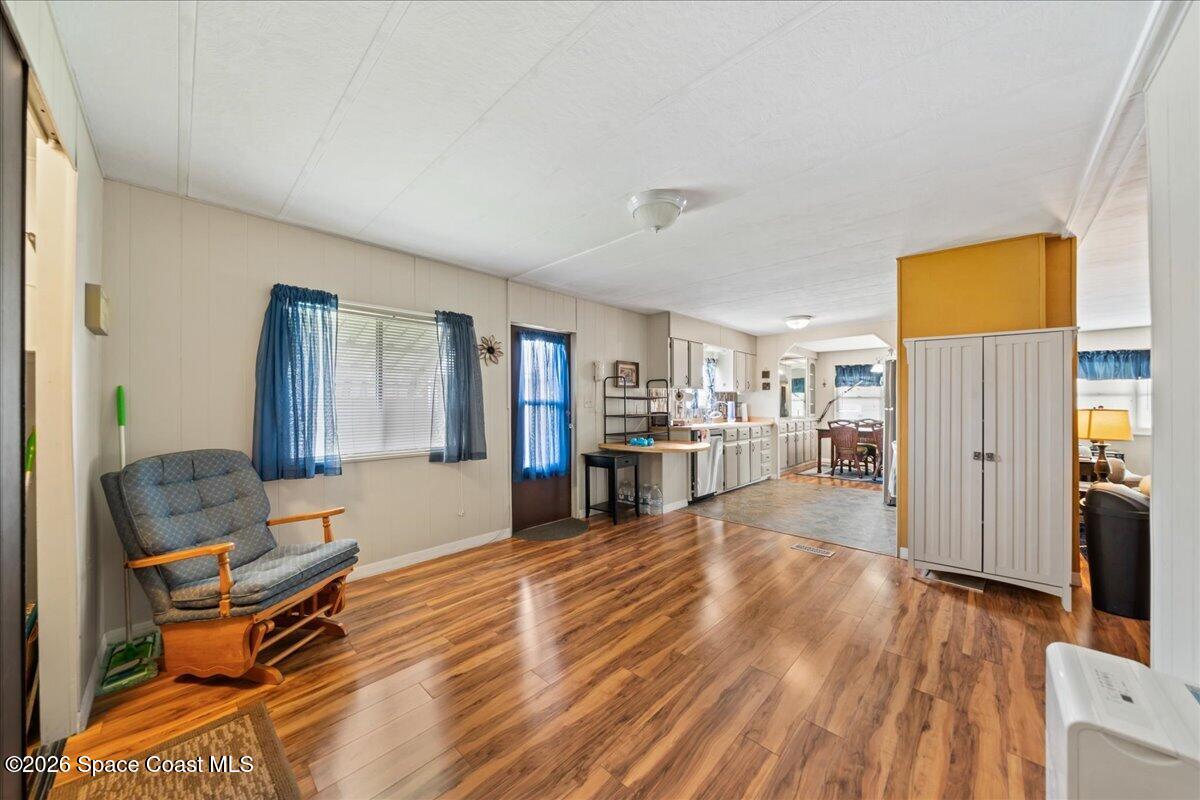 1740 Seagrape Street Northeast Palm Bay, FL 32905 - Photo 9 of 33 a room with furniture and a wooden floor
