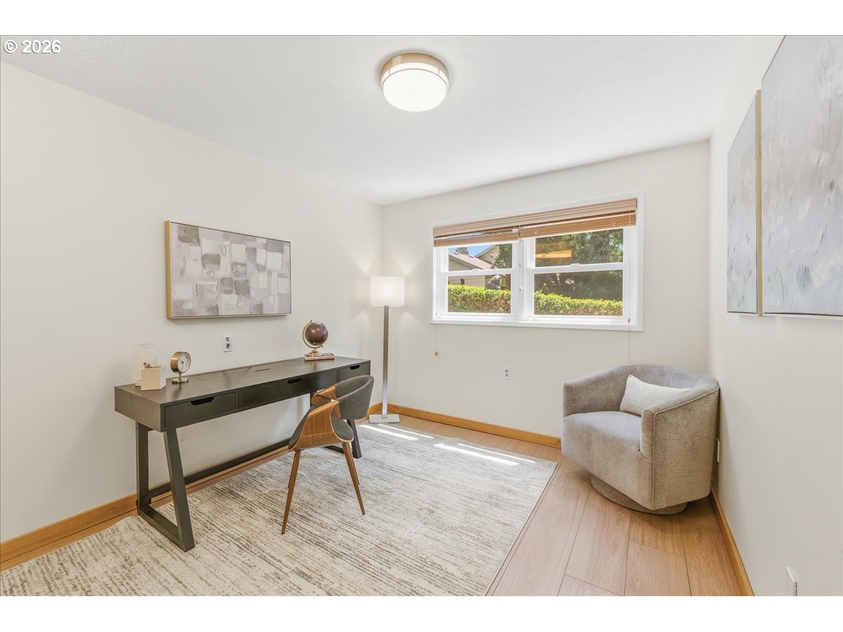 3130 Southwest 116th Avenue Beaverton, OR 97005 - Photo 31 of 44 a living room with furniture and a wooden floor