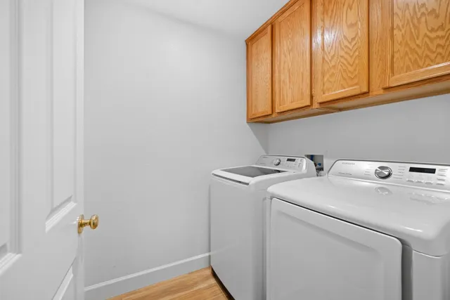 a view of storage and utility room with washer and dryer