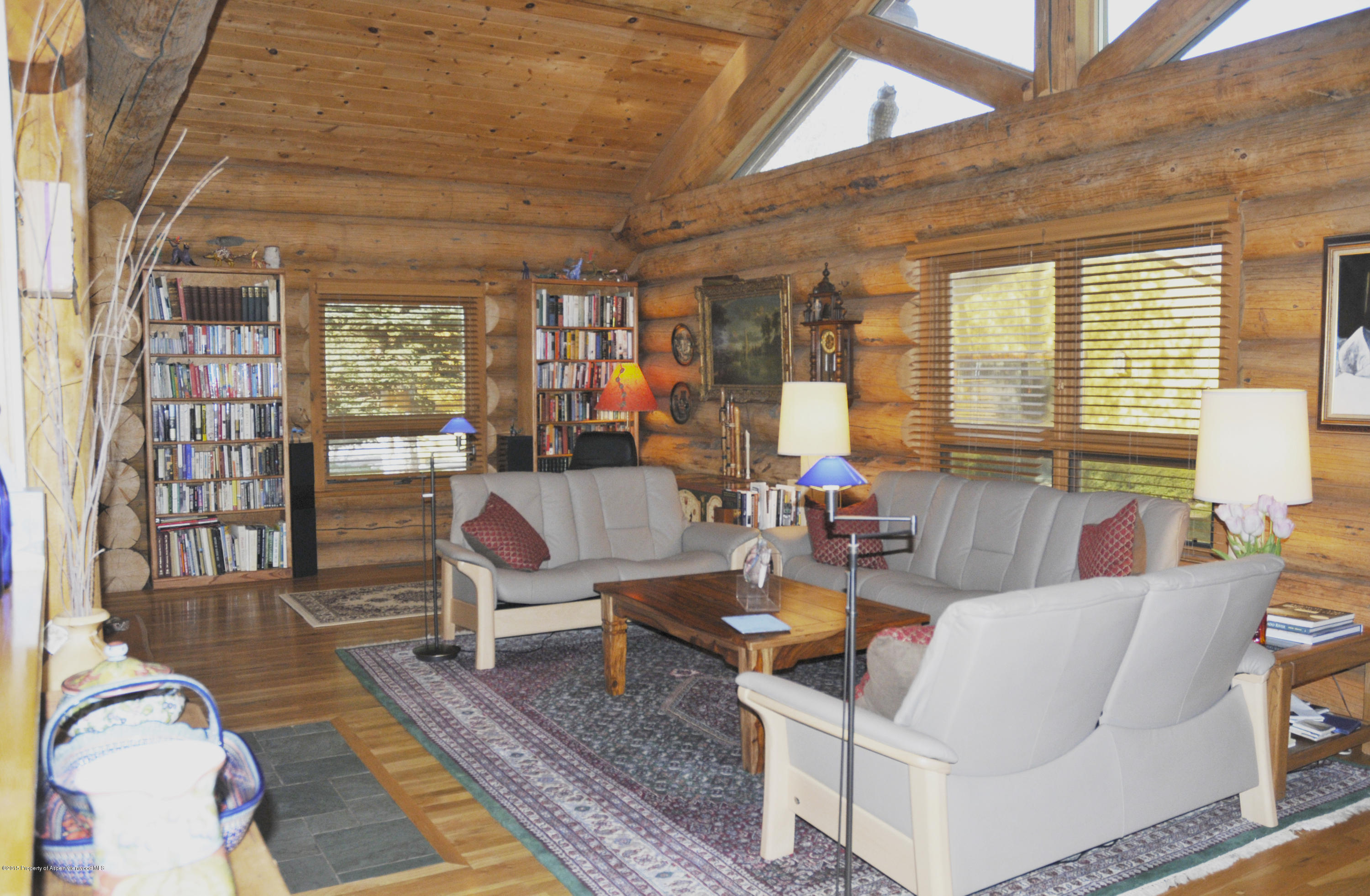 1637 Emma Spur Basalt, CO 81621 - Photo 23 of 35 a living room with furniture large window and wooden floor