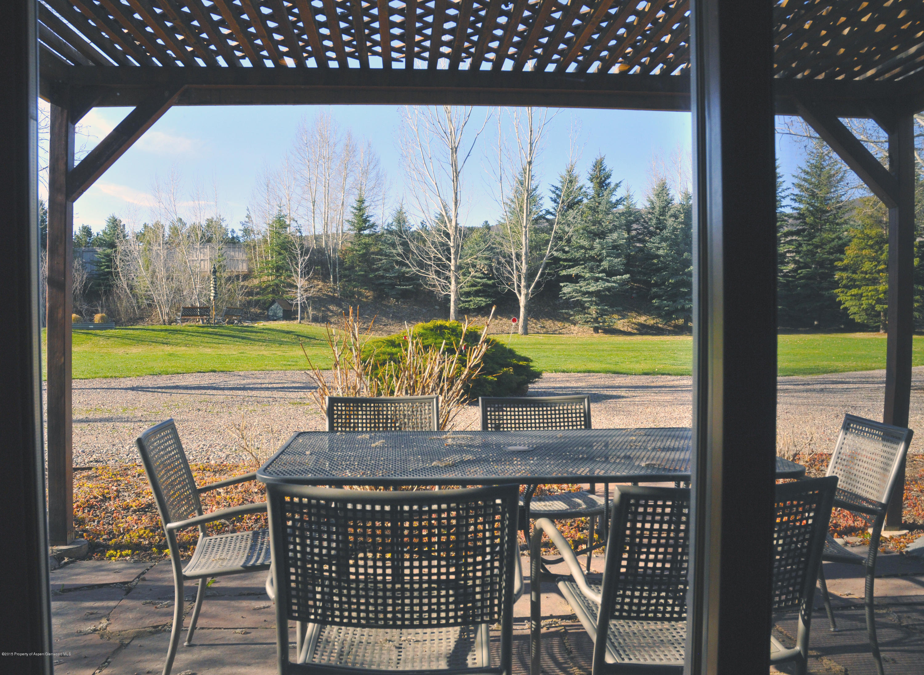 1637 Emma Spur Basalt, CO 81621 - Photo 26 of 35 a view of swimming pool with a table and chairs next to a yard
