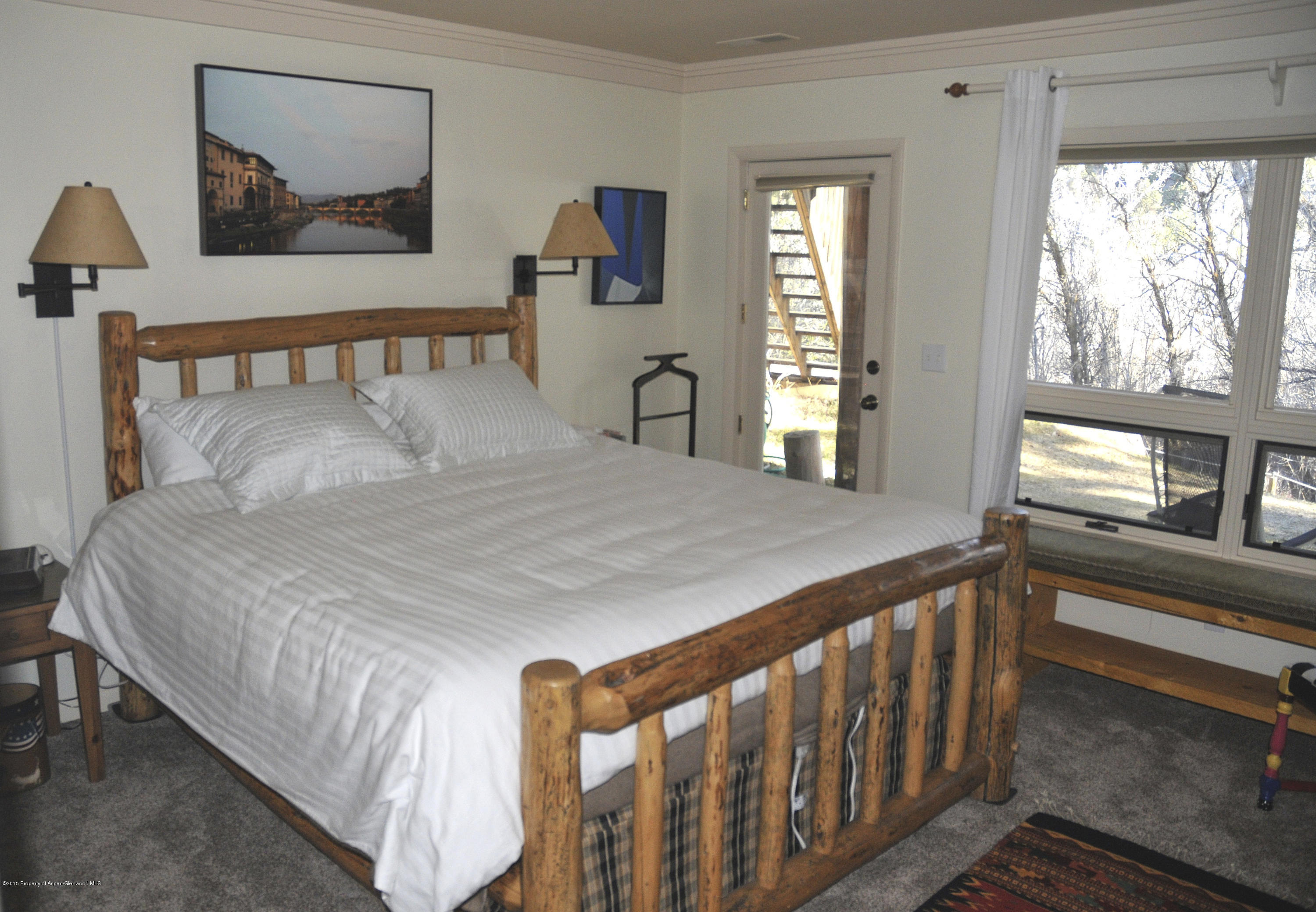 1637 Emma Spur Basalt, CO 81621 - Photo 35 of 35 a bedroom with a bed and a large window