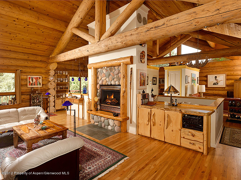 1637 Emma Spur Basalt, CO 81621 - Photo 5 of 35 a living room with furniture a fireplace and a table