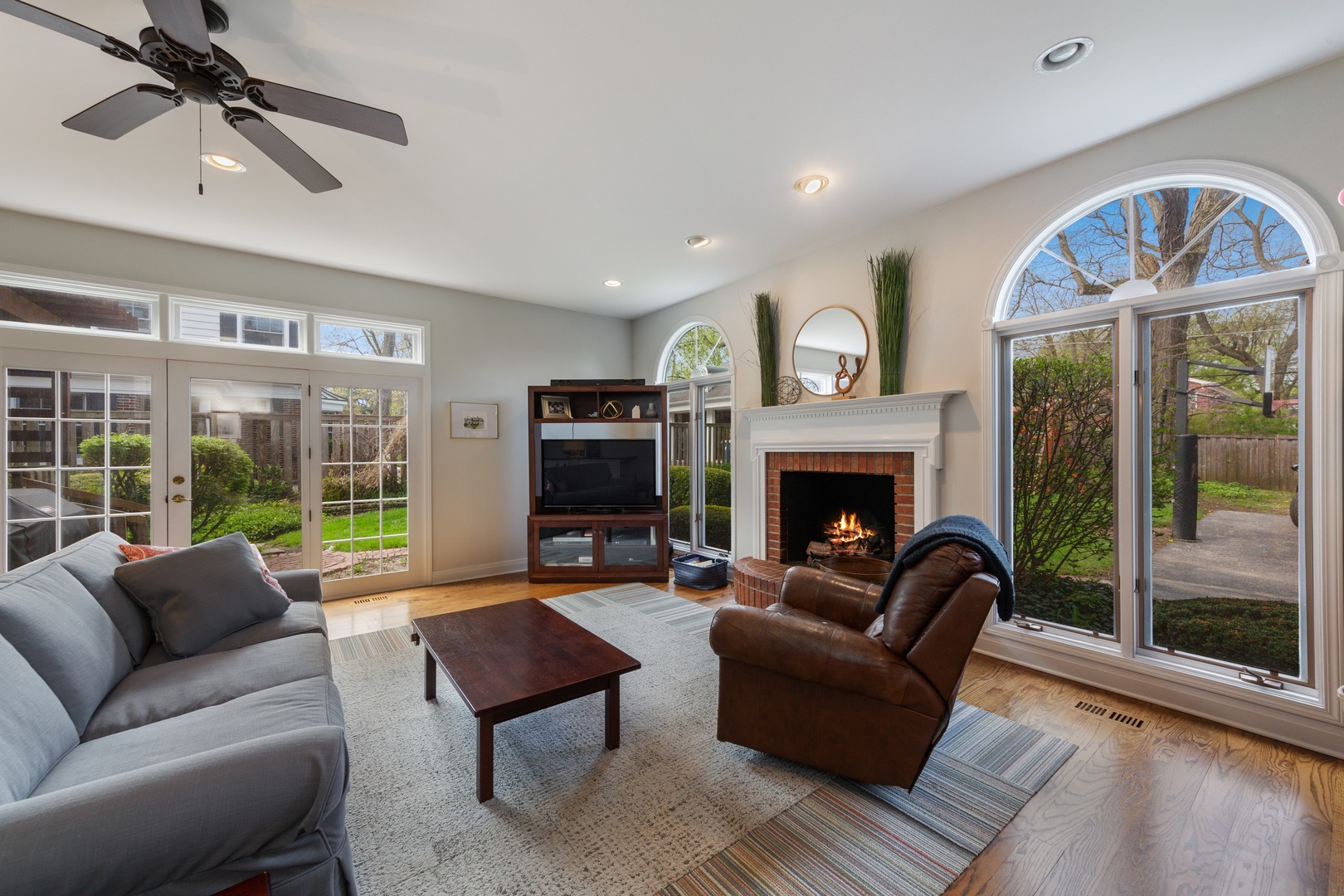 330 Radcliffe Way Hinsdale, IL 60521 - Photo 12 of 27 a living room with furniture a large window and a fireplace
