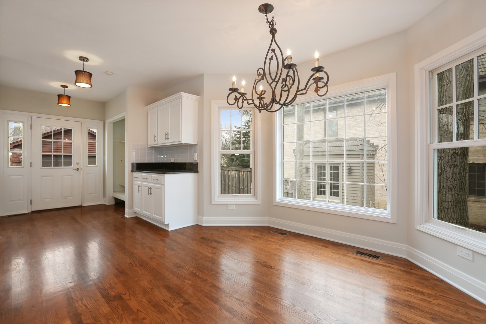 330 Radcliffe Way Hinsdale, IL 60521 - Photo 16 of 27 a view of an empty room with wooden floor and a window