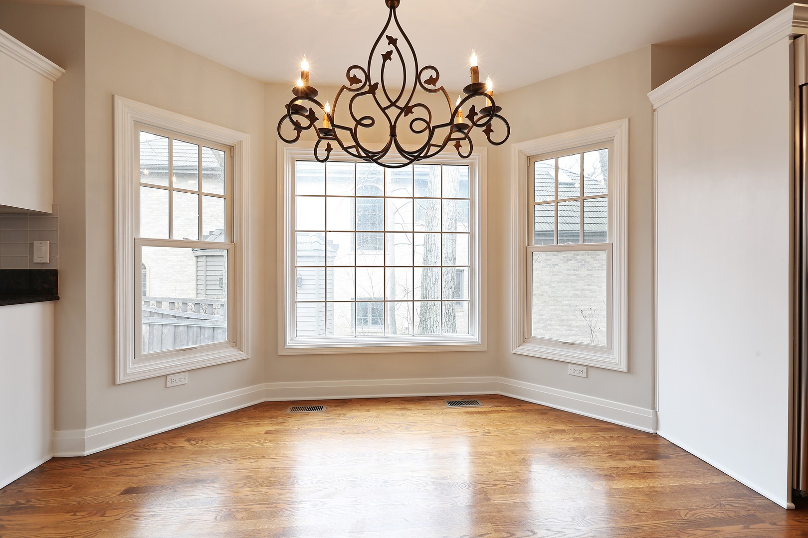 330 Radcliffe Way Hinsdale, IL 60521 - Photo 18 of 27 an empty room with wooden floor and windows