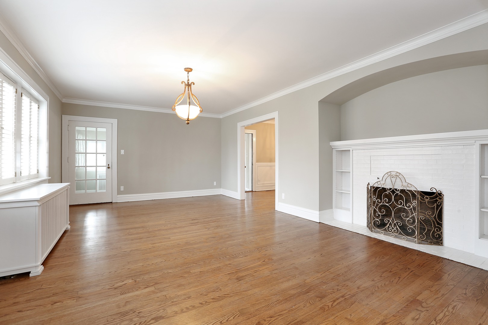 330 Radcliffe Way Hinsdale, IL 60521 - Photo 7 of 27 an empty room with wooden floor fireplace and windows