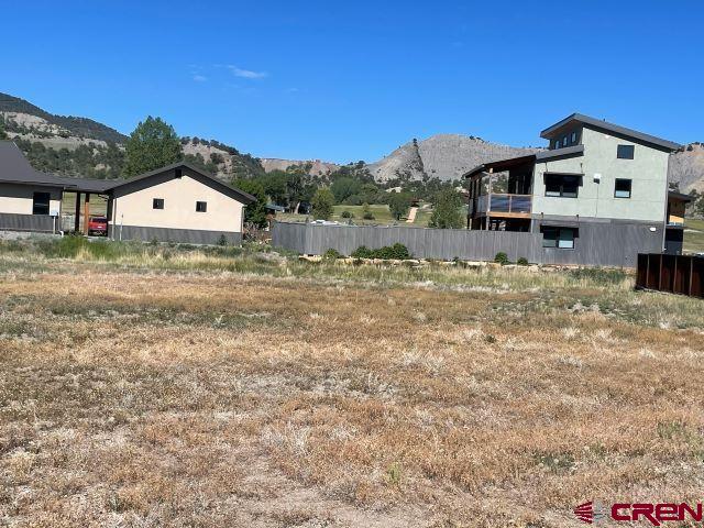 413 Kismet Street Ridgway, CO 81432 - Photo 9 of 9 a view of a house with a yard