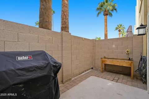 a view of a street with potted plants
