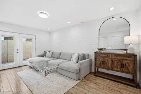 a living room with furniture and a fireplace