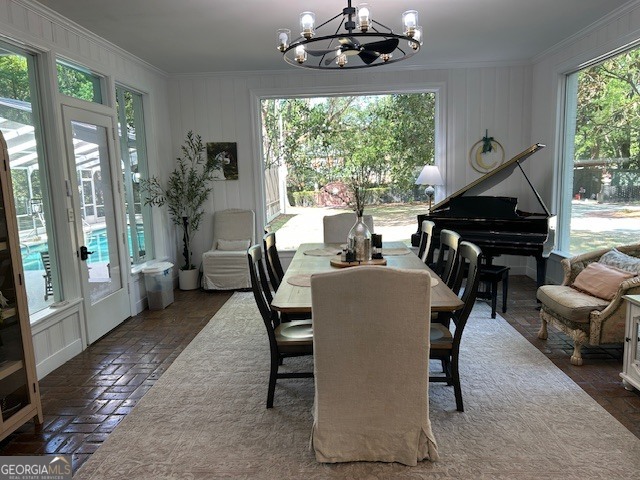 1156 South Main Street Moultrie, GA 31768 - Photo 18 of 56 a dining room with furniture a chandelier and wooden floor