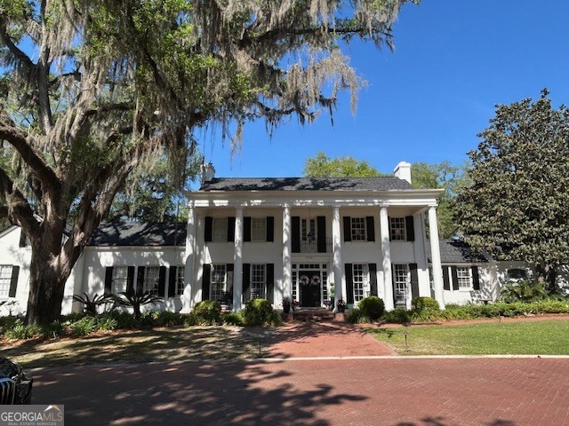 1156 South Main Street Moultrie, GA 31768 - Photo 2 of 56 a view of a big house with a large tree and many windows