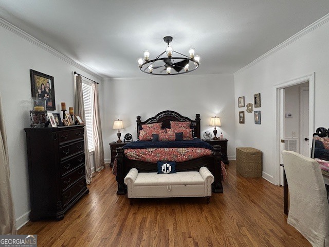 1156 South Main Street Moultrie, GA 31768 - Photo 31 of 56 a bedroom with a bed and wooden floor