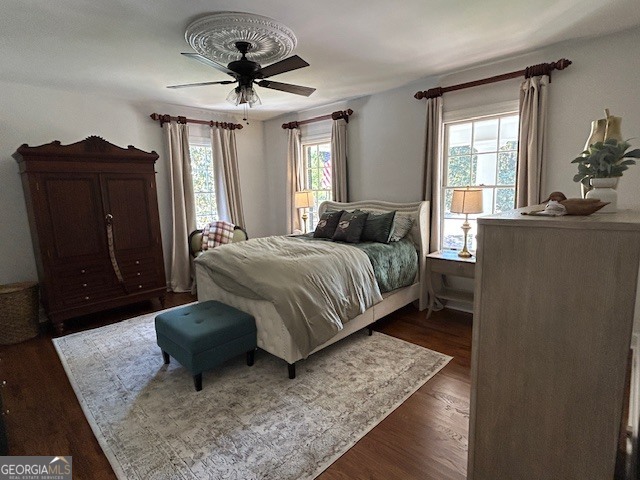 1156 South Main Street Moultrie, GA 31768 - Photo 39 of 56 a bedroom with a bed and wooden floor