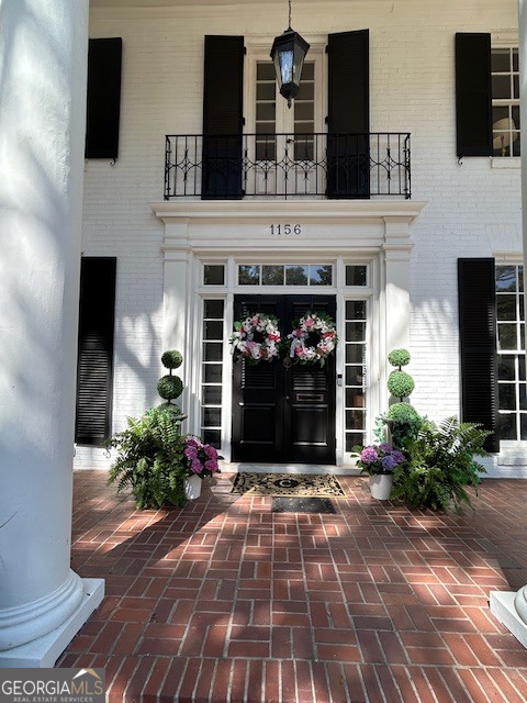 1156 South Main Street Moultrie, GA 31768 - Photo 6 of 56 a view of a house with potted plants and a fireplace