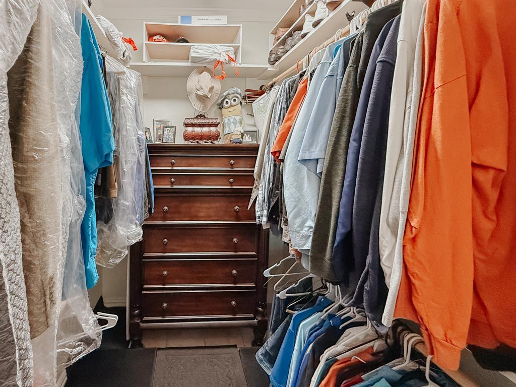 128 Meandering Way Mabank, TX 75156 - Photo 18 of 38 a view of walk in closet with clothes and shoes