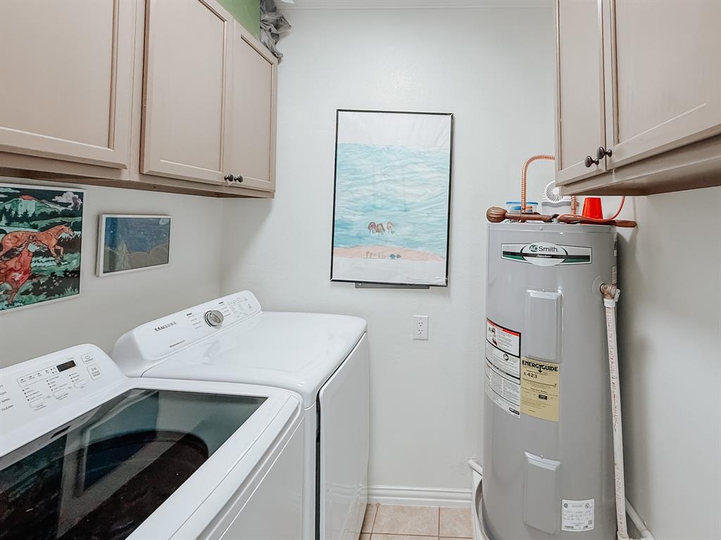 128 Meandering Way Mabank, TX 75156 - Photo 19 of 38 a utility room with dryer and washer