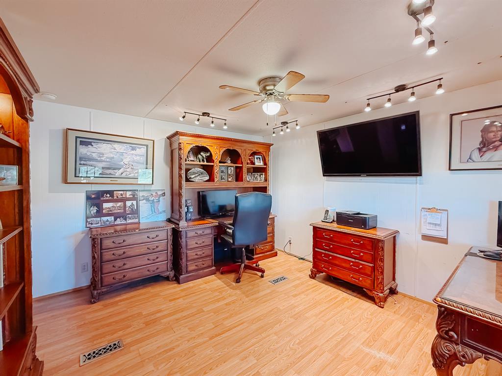 128 Meandering Way Mabank, TX 75156 - Photo 25 of 38 a view of a livingroom with furniture and a flat screen tv