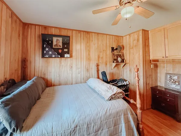 a view of a livingroom with furniture and hardwood floor
