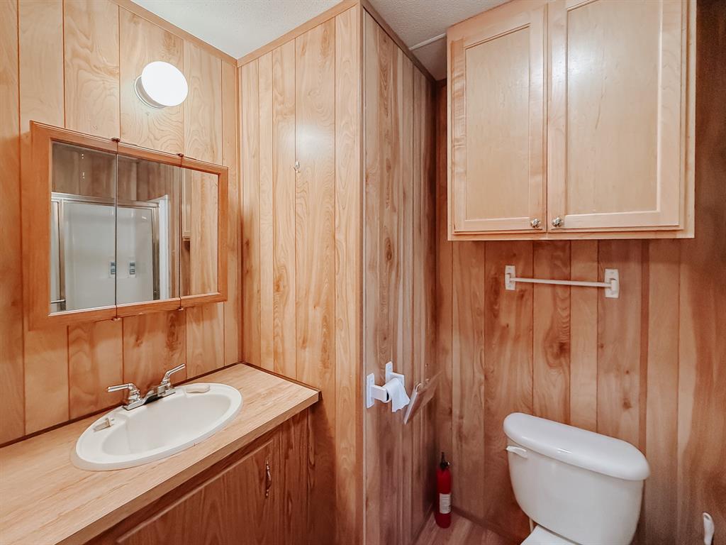 128 Meandering Way Mabank, TX 75156 - Photo 34 of 38 a bathroom with a sink a toilet and shower