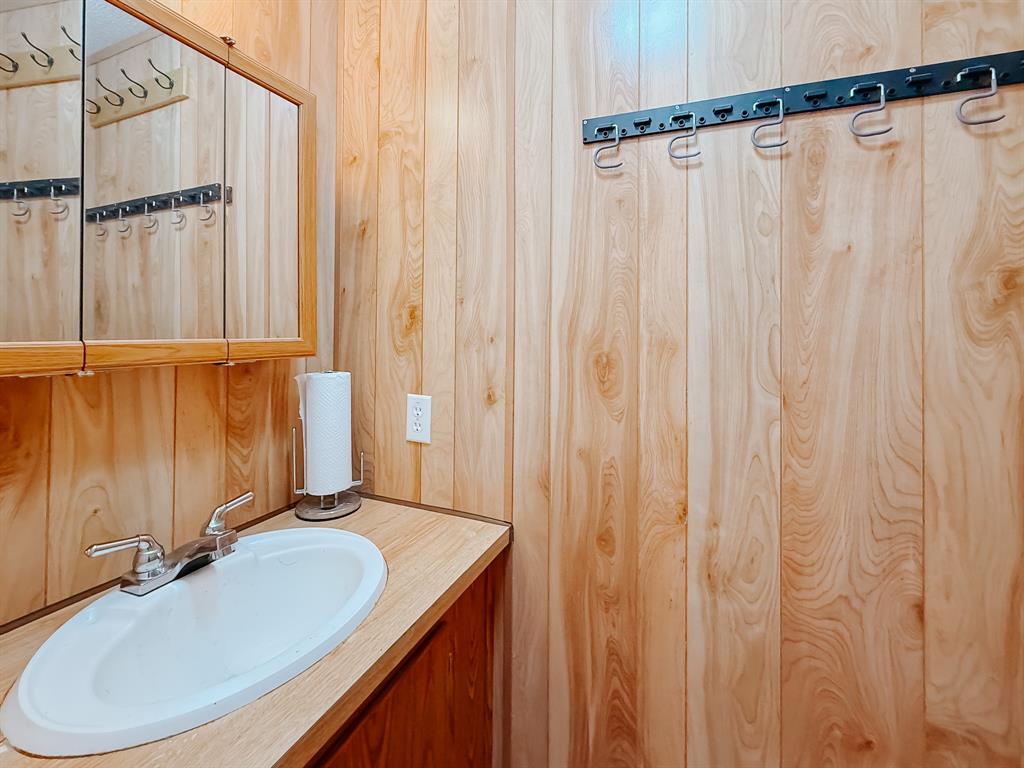 128 Meandering Way Mabank, TX 75156 - Photo 37 of 38 a bathroom with a sink and a mirror