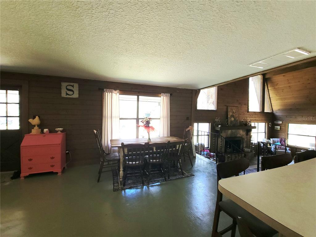 1600 Southwest 42nd Street Ocala, FL 34471 - Photo 14 of 39 a living room with furniture and a large window